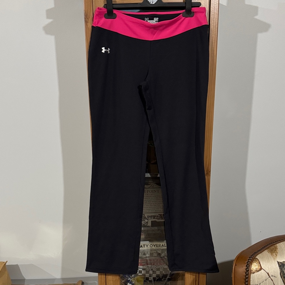 Woman Under Armour Black Leggings with Vibrant Pink Waistband